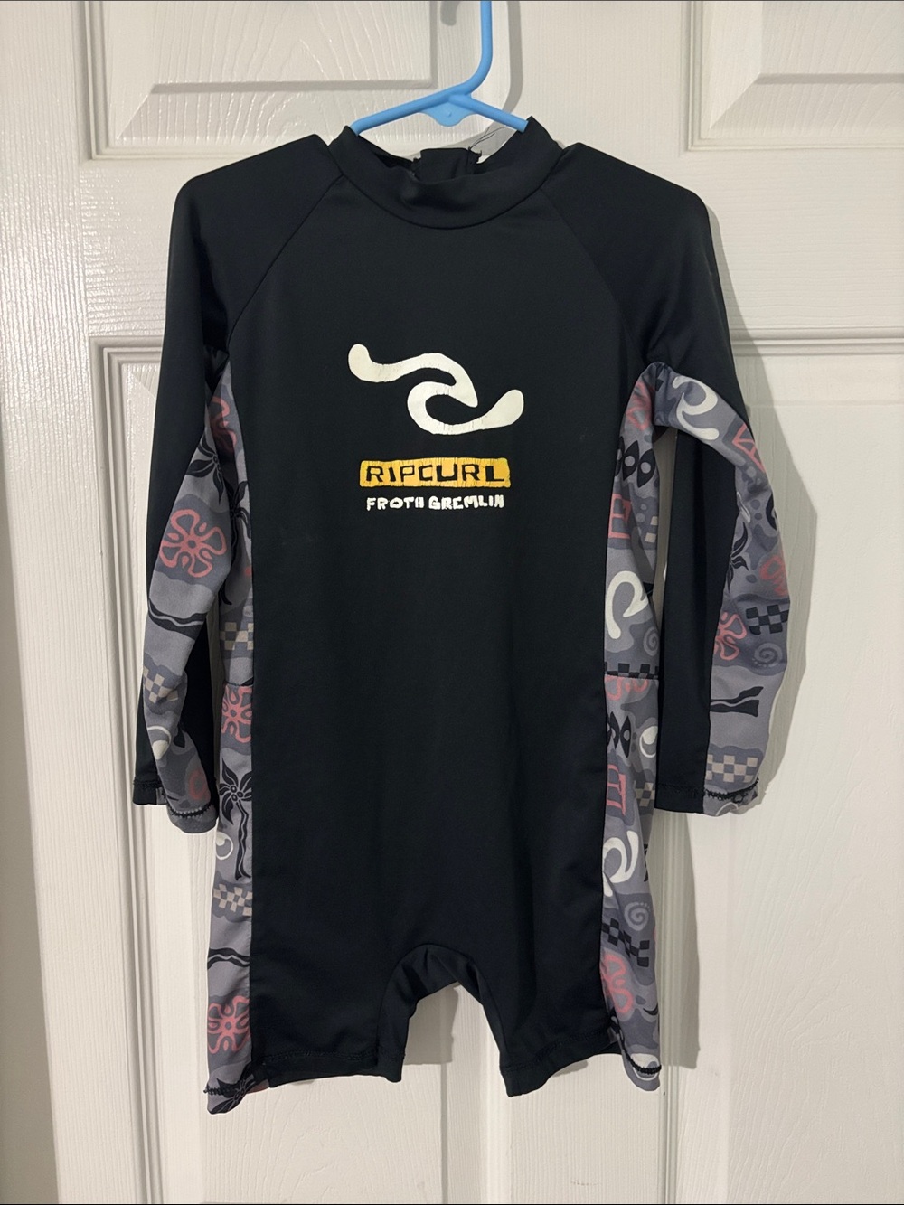 Rip Curl Kids Black Rashguard with Gray Patterned Side Panels and Yellow Logo